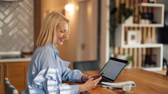 Happy woman working at a table